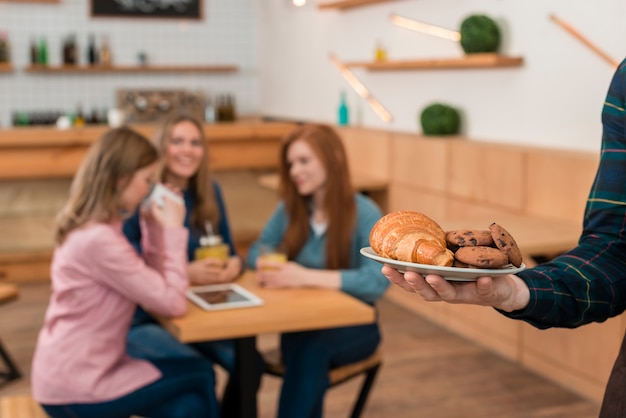 Person holding plate with cookies