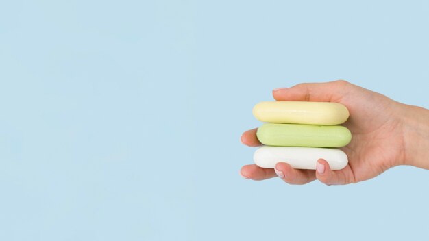 Person holding soaps