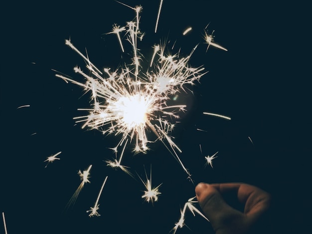 Free photo person holding a sparkler