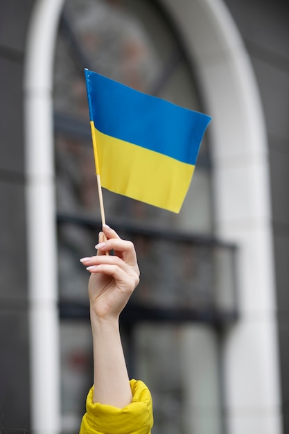 Person holding ukrainian flag