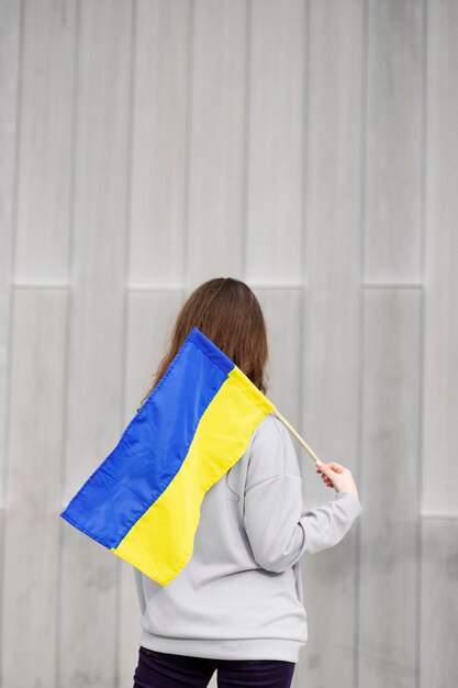 Person holding ukrainian flag