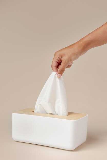 Person holding a white nasal handkerchief