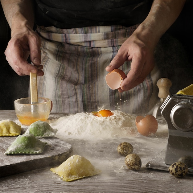 Person holding wooden spoon and egg