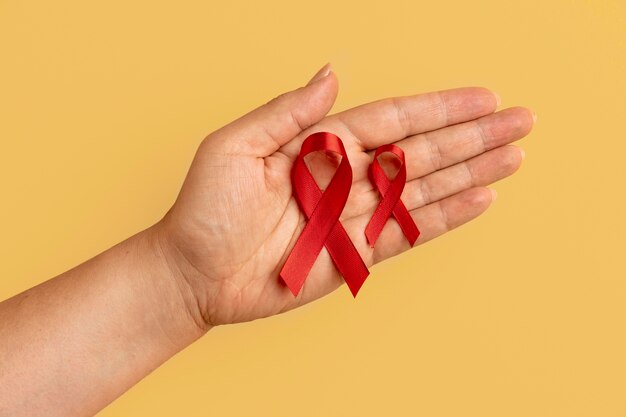 Person holding an world aids day ribbon