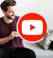 Free photo person holding a youtube icon