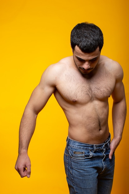 Free photo a person in jeans posing in studio