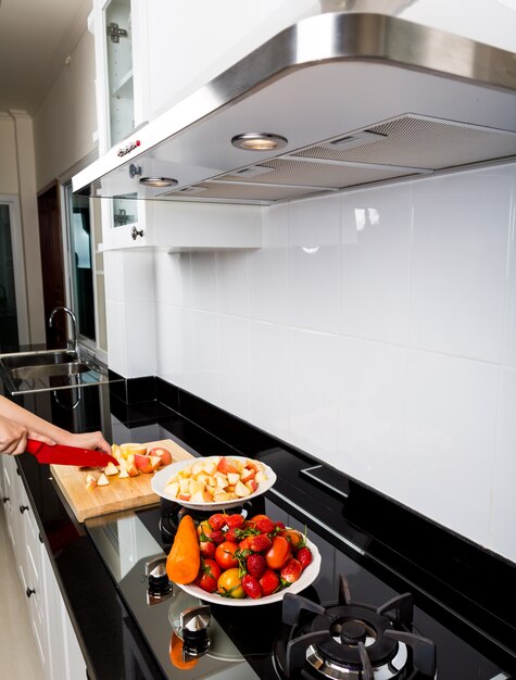 Person in a kitchen cooking food