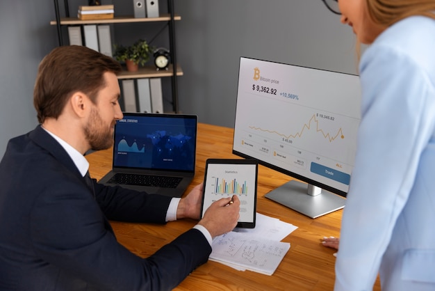 Free photo person looking over finance graphs