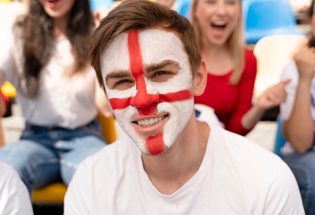 Person looking at a football game in a sunny day