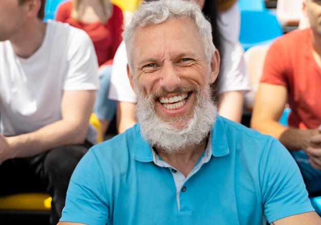 Person looking at a football game in a sunny day