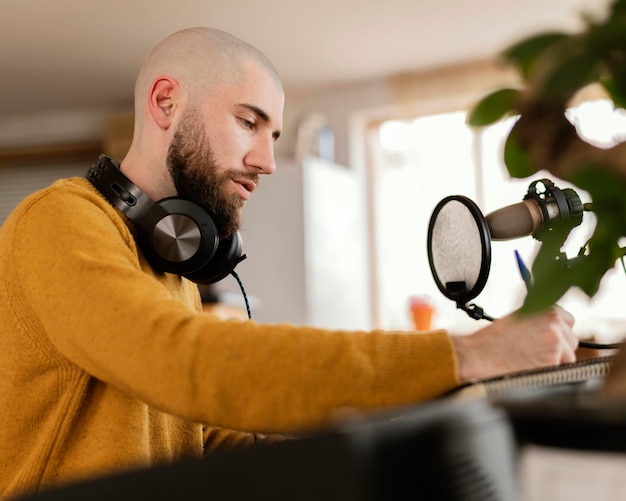 Free photo person making music indoors