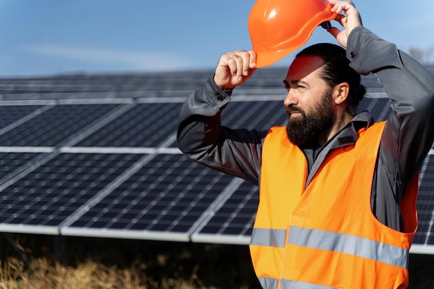 Person near alternative energy plant