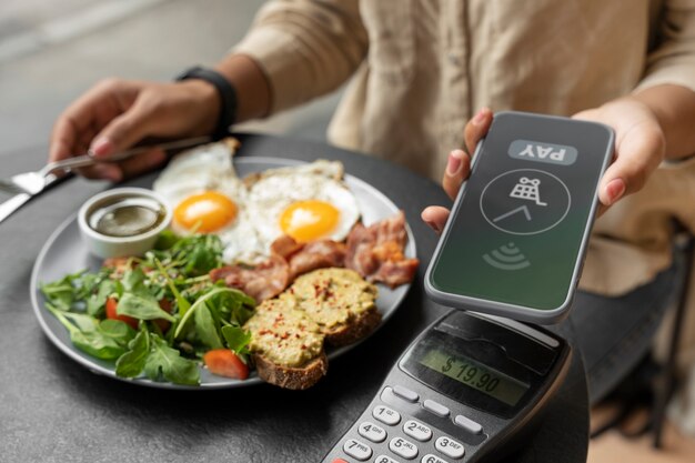 Person paying using nfc technology