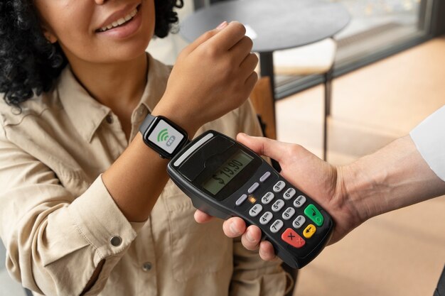 Person paying using nfc technology