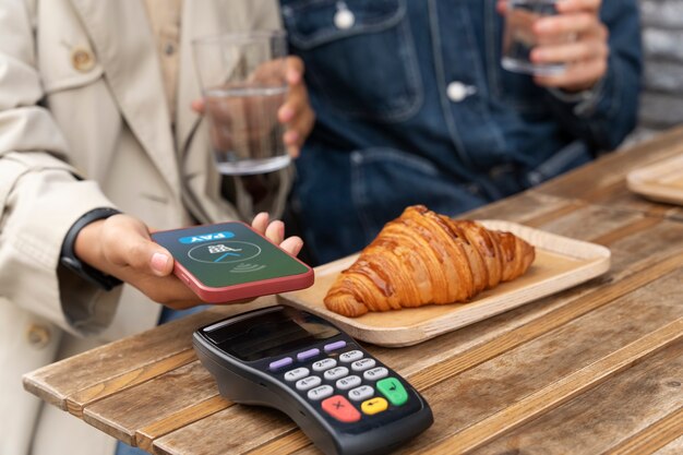 Person paying using nfc technology