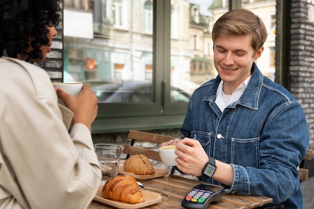 Person paying using nfc technology