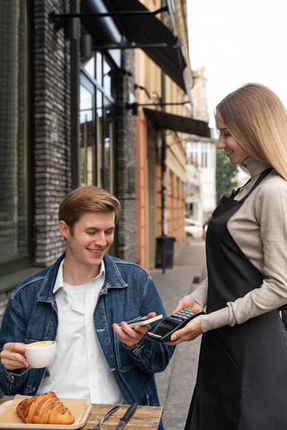 Person paying using nfc technology