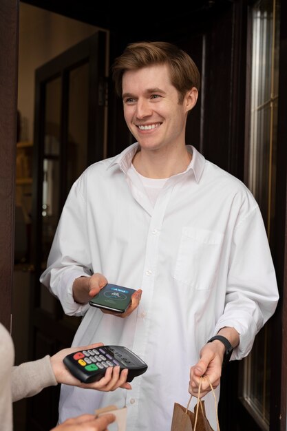 Person paying using nfc technology