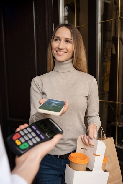 Free photo person paying using nfc technology