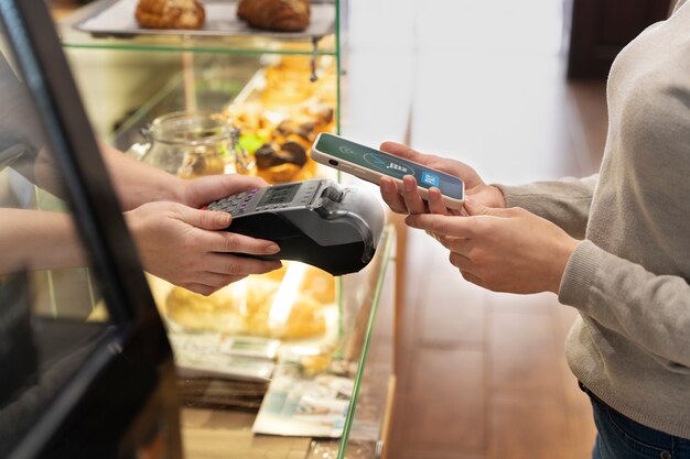 Person paying using nfc technology