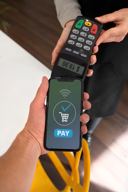 Person paying using nfc technology