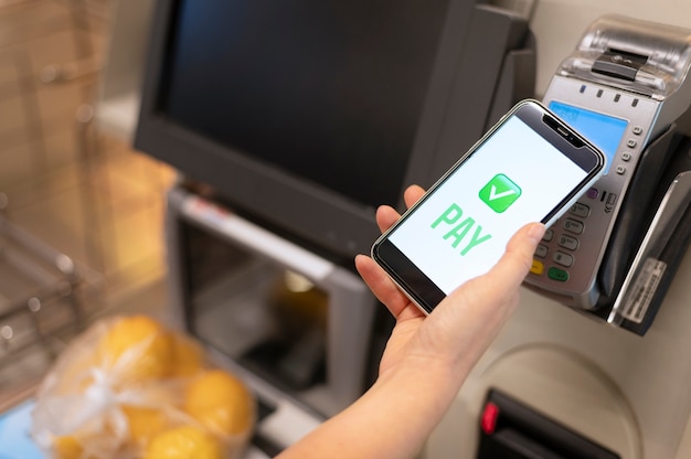 Person paying with its smartphone wallet app