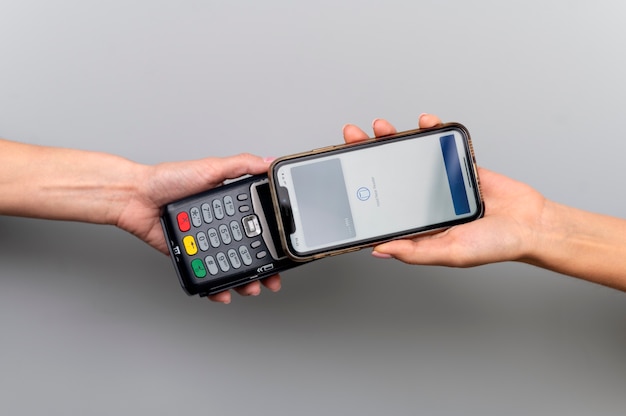 Person paying with its smartphone wallet app