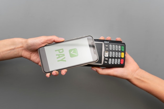 Person paying with its smartphone wallet app