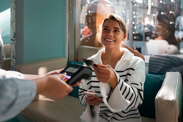 Free photo person paying with nfc technology at a restaurant