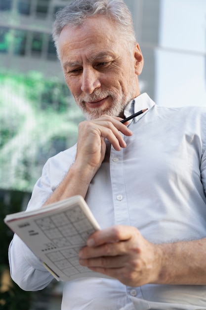 Free photo person playing a sudoku game alone