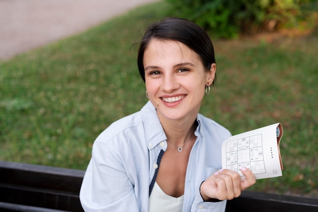 Person playing a sudoku game alone