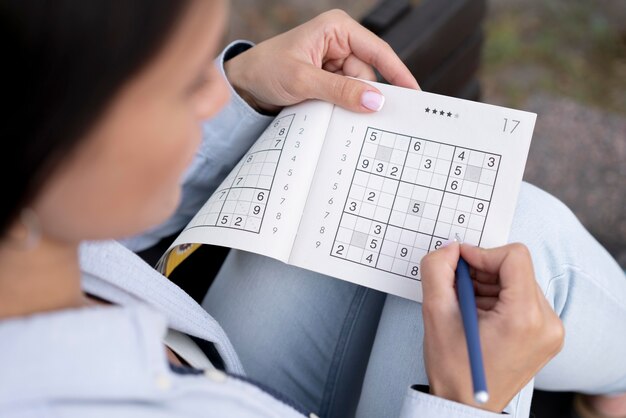 Person playing a sudoku game alone