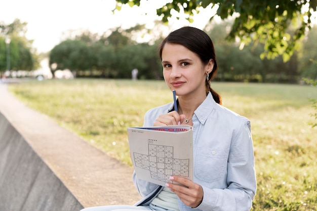 Free photo person playing a sudoku game alone