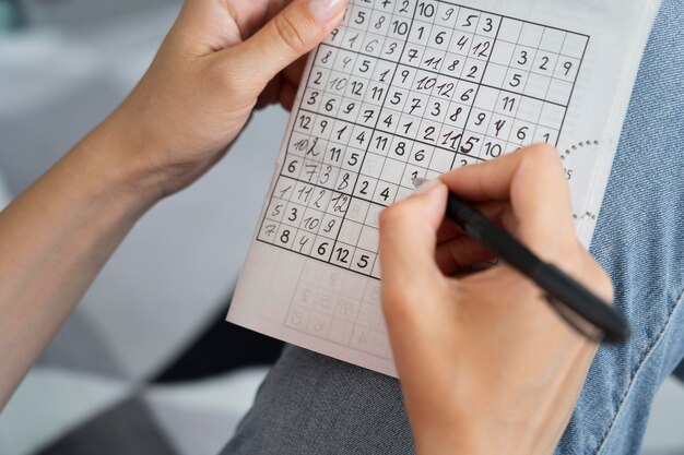 Person playing a sudoku game