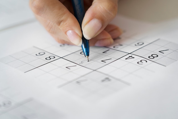 Person playing a sudoku game