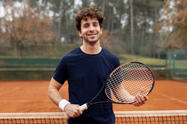 Person playing tennis game in winter time