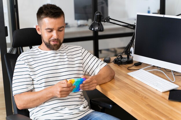 Person playing with ush pop bubble fidget sensory toy