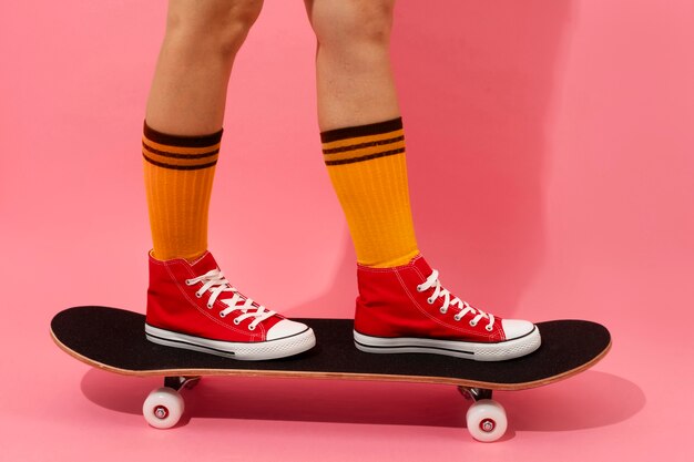 Person posing with skateboard