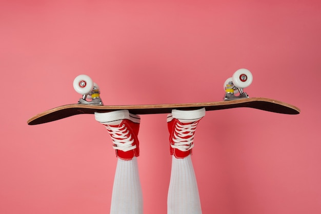 Person posing with skateboard