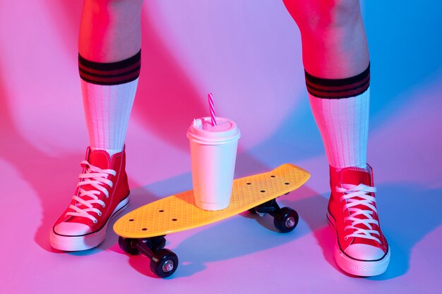 Person posing with skateboard