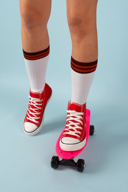 Person posing with skateboard