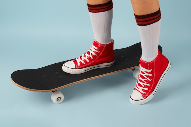 Person posing with skateboard