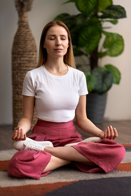 person practicing tai chi indoors