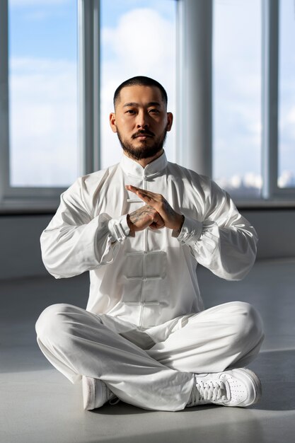 Person practicing tai chi indoors