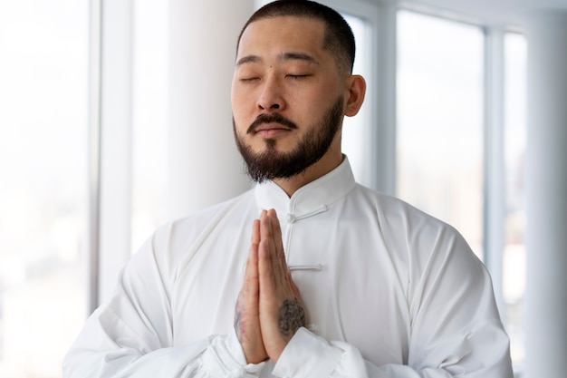 person practicing tai chi indoors