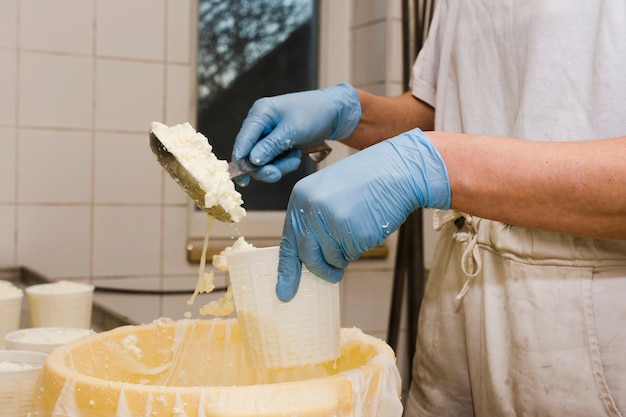 Person preparing a new type of cheese