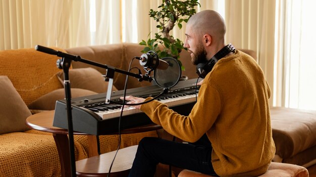person producing music alone at home