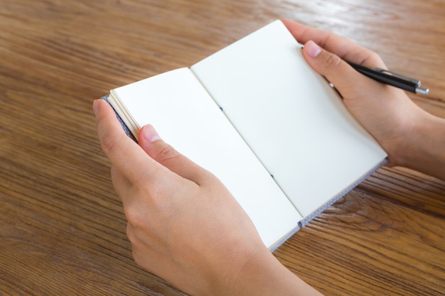 Person reading a blank book