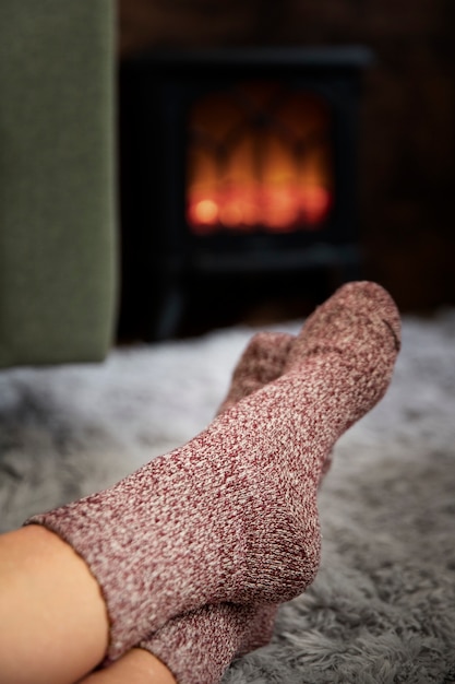 Free photo person relaxing on winter with cozy clothing