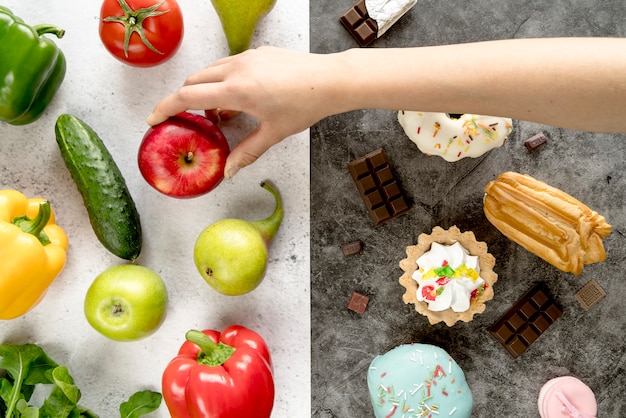 Free photo person's hand taking apple from healthy food